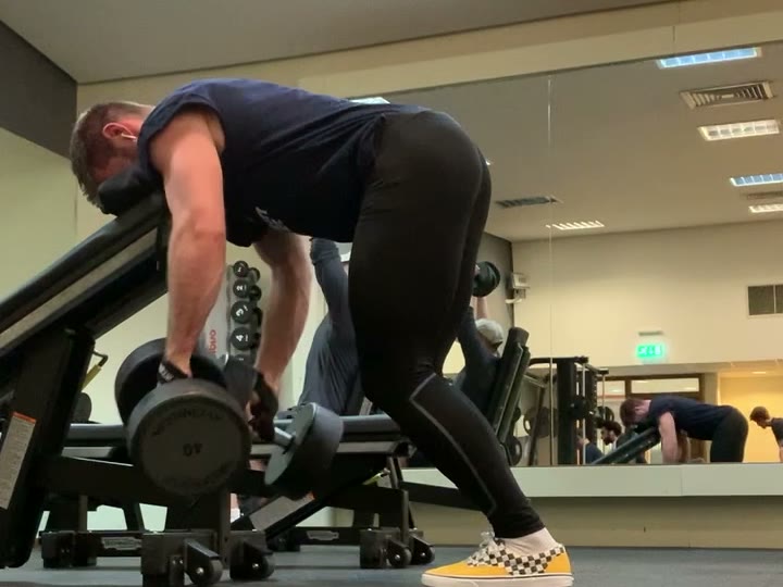 Balazs Morvay rowing a heavy dumbbell - training that fits around real life