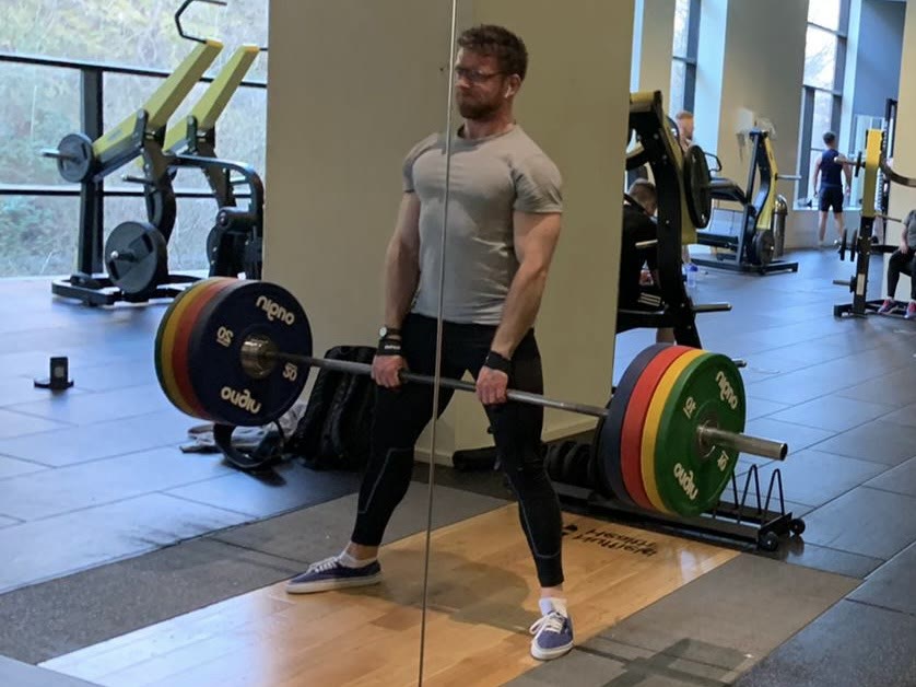 Balazs Morvay deadlifting a loaded barbell